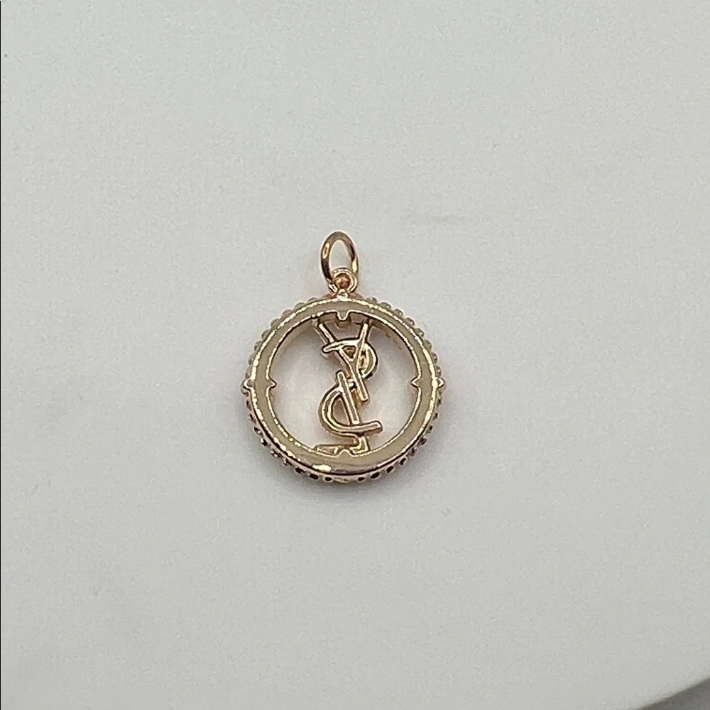 868. Elegant Gold YSL Pendant on 18” gold plated chain. - Picture 7 of 8